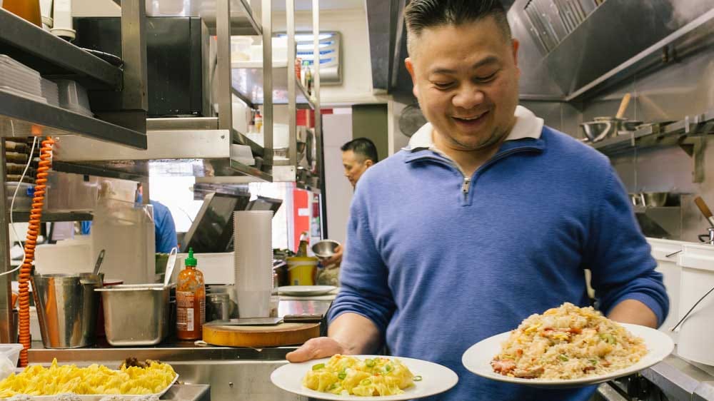 Mr Minh holding his food